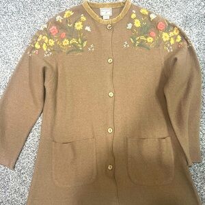 Long wool cardigan with hand embroidery and velvet trim on collar.